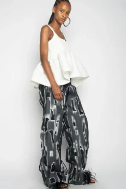 WHITE SLEEVELESS PUFF HEM TOP